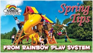 spring tips from rainbow play system - kids playing on wooden swing set
